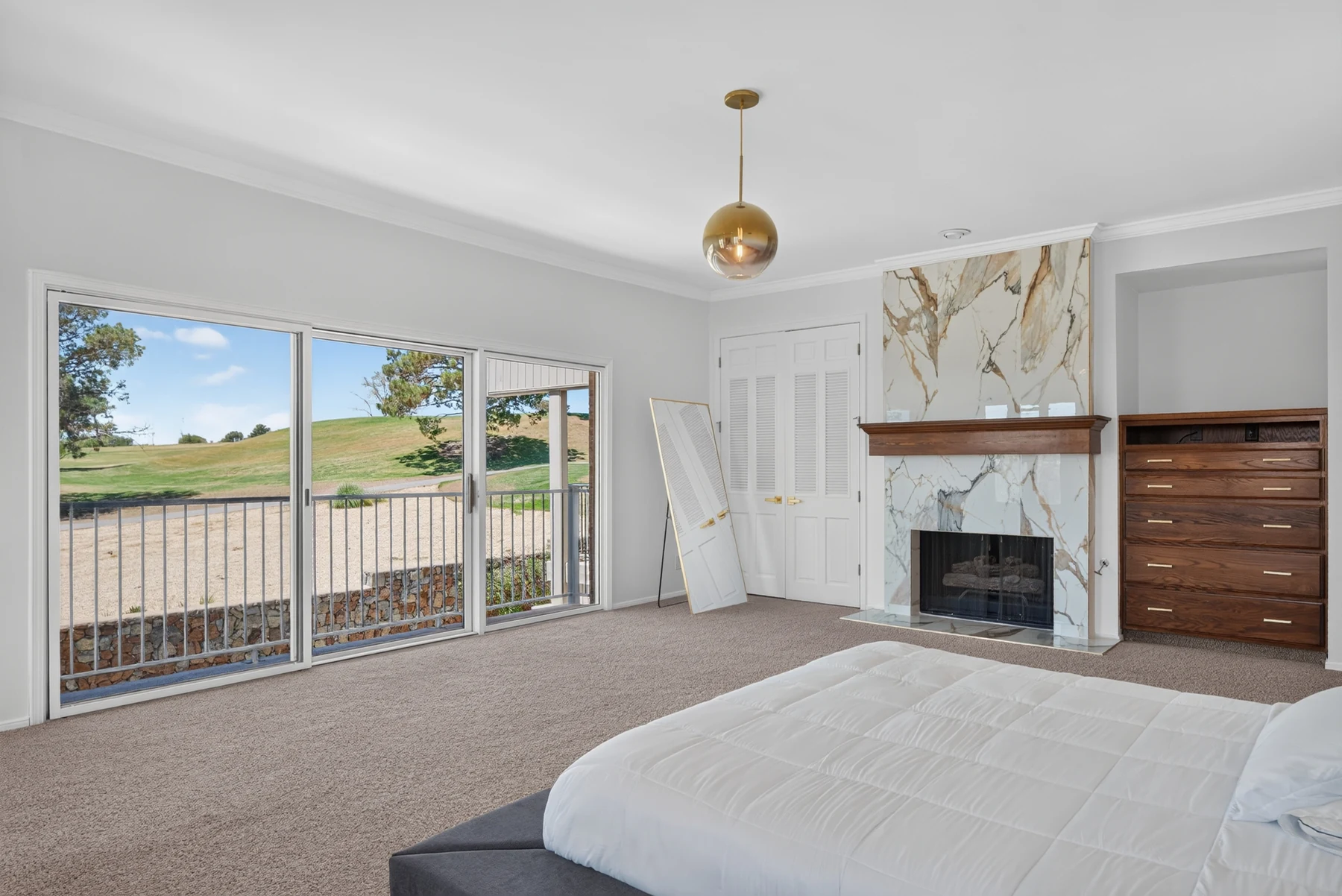 Bedroom with fireplace and access to outdoor space