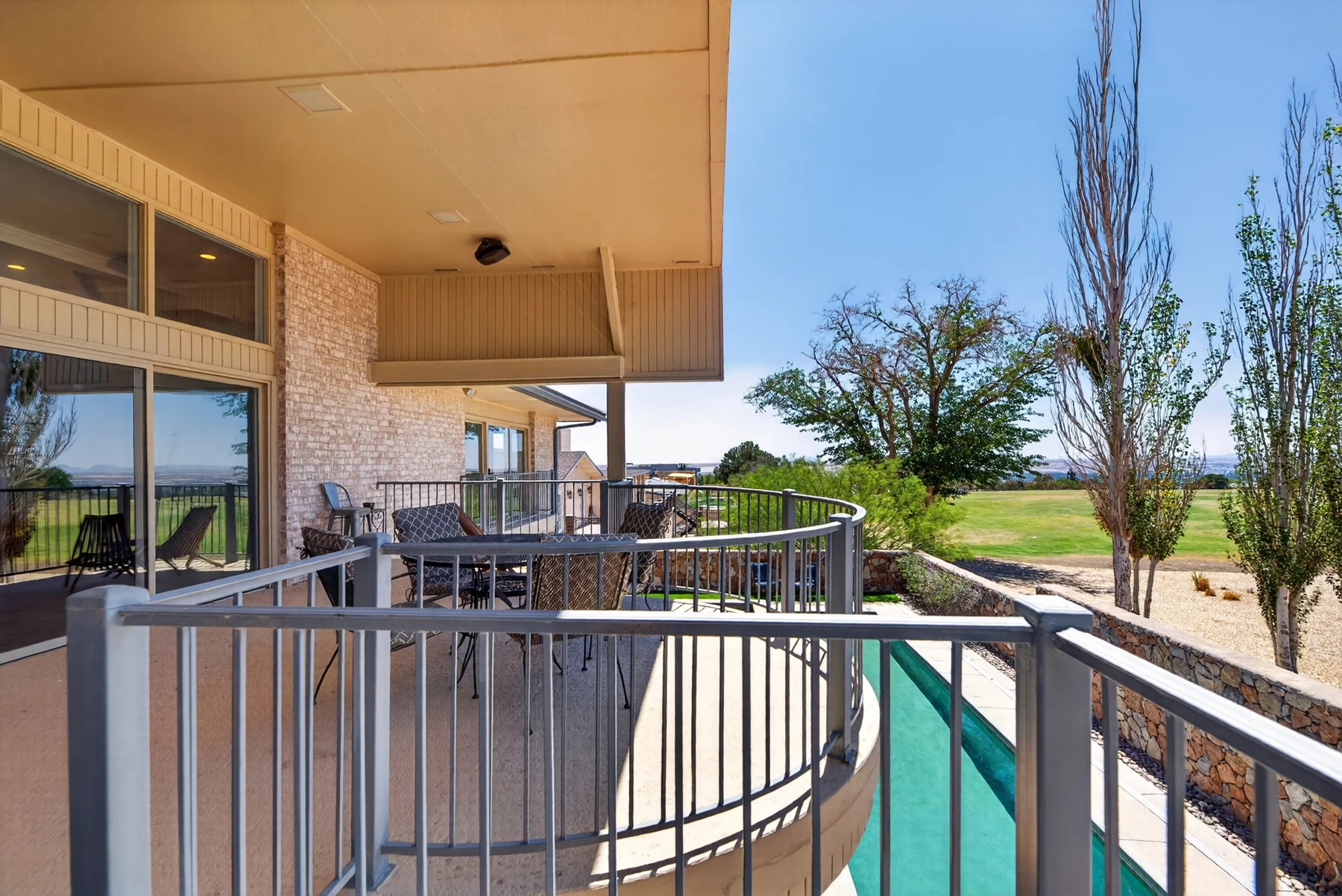 Covered outdoor terrace looking toward the golf course